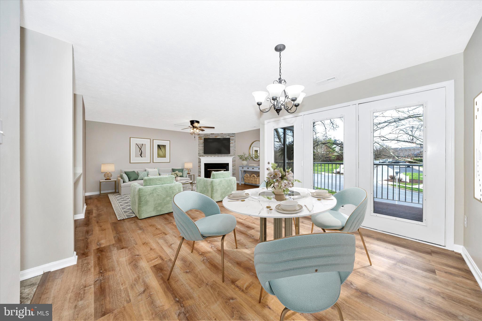 2112 Whitehall Road, Unit 1C Frederick, MD 21702 - Photo 12 of 33 a view of a dining room with furniture wooden floor and chandelier
