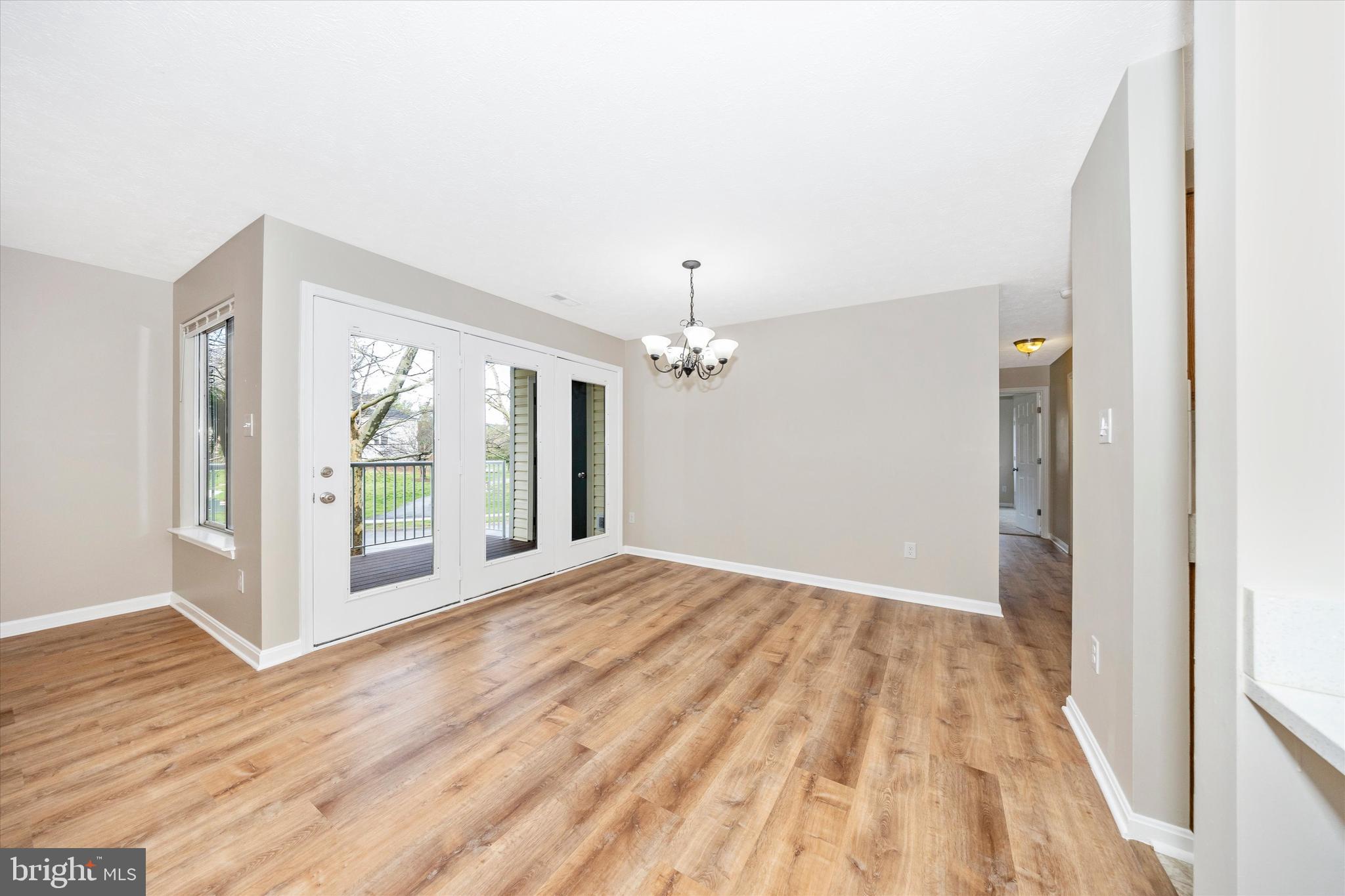 2112 Whitehall Road, Unit 1C Frederick, MD 21702 - Photo 14 of 33 a view of empty room with wooden floor and fan