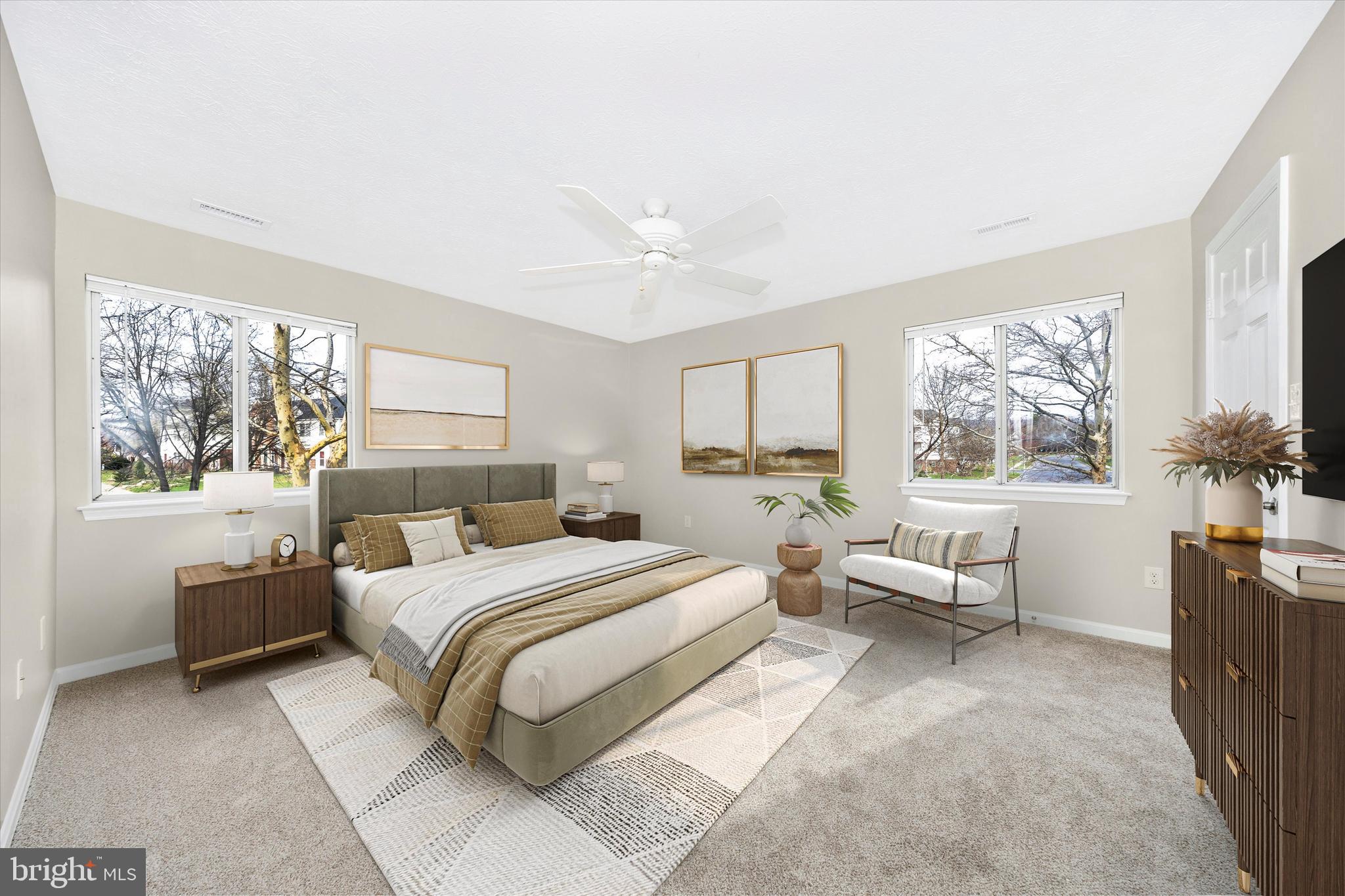 2112 Whitehall Road, Unit 1C Frederick, MD 21702 - Photo 15 of 33 a bedroom with a large bed couch and two windows