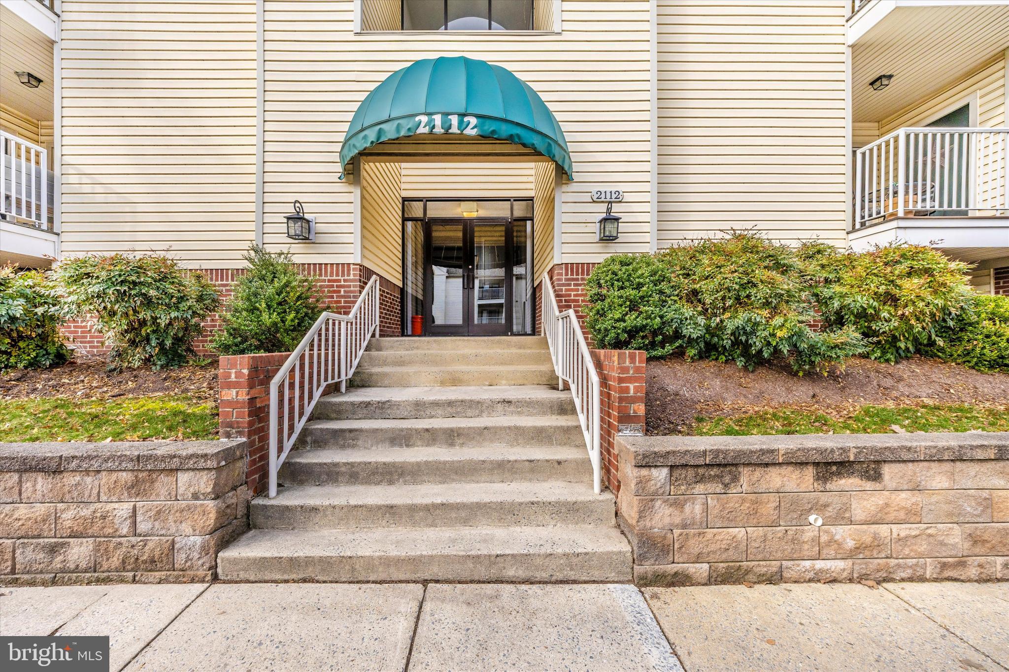 2112 Whitehall Road, Unit 1C Frederick, MD 21702 - Photo 2 of 33 a front view of a house with a yard
