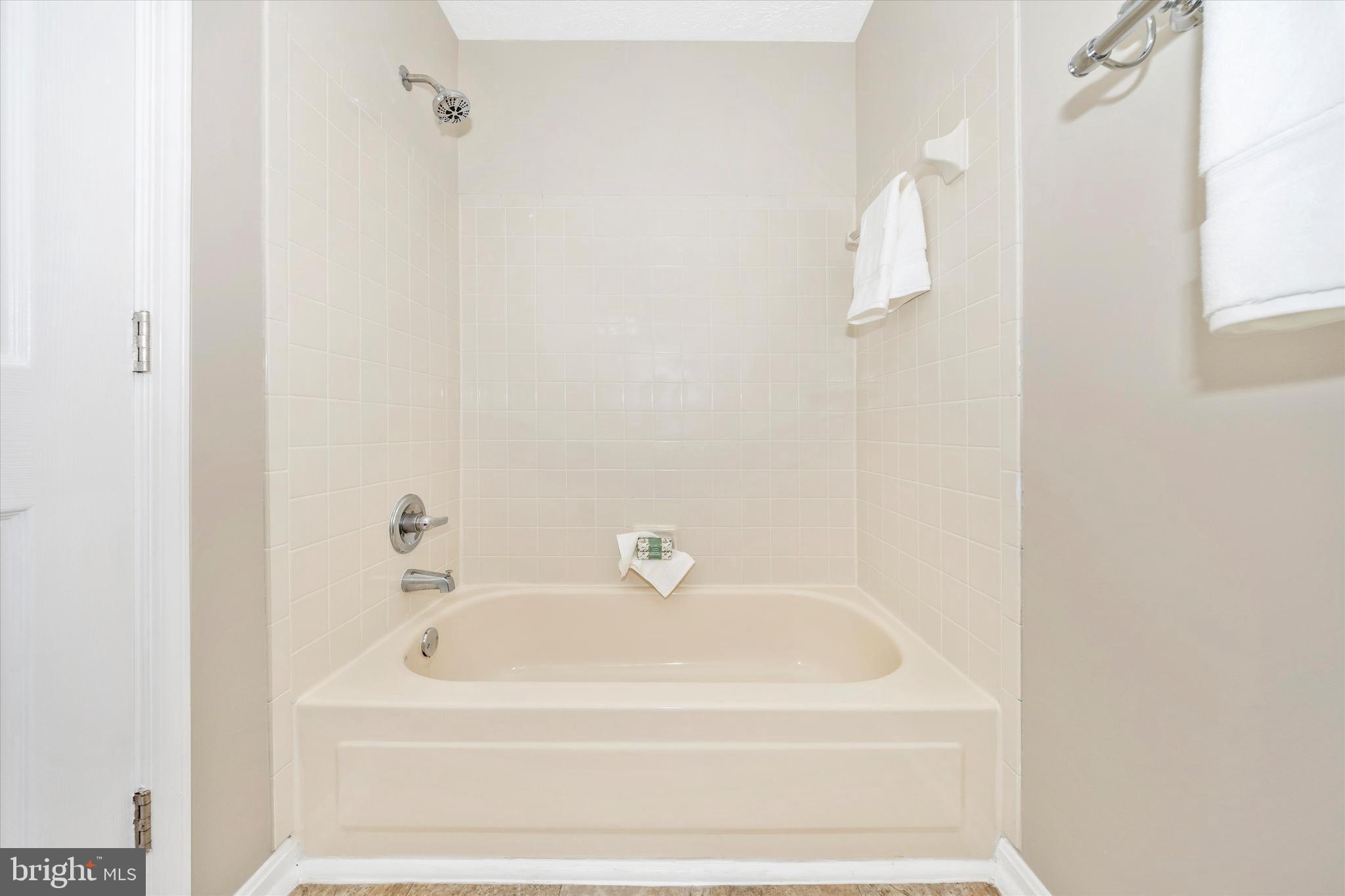 2112 Whitehall Road, Unit 1C Frederick, MD 21702 - Photo 21 of 33 a white bath tub sitting next to a white sink