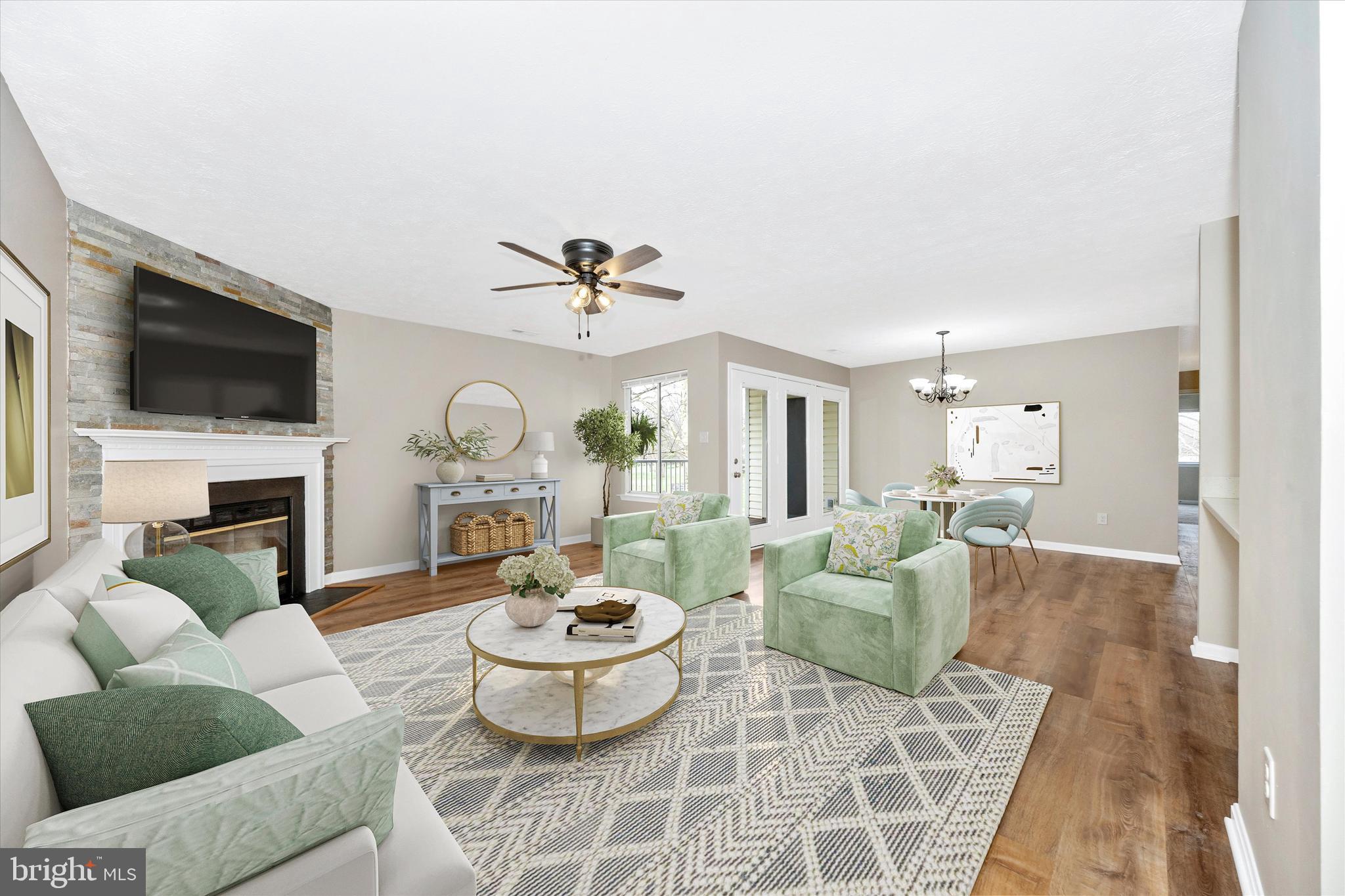 2112 Whitehall Road, Unit 1C Frederick, MD 21702 - Photo 6 of 33 a living room with furniture a fireplace and a flat screen tv