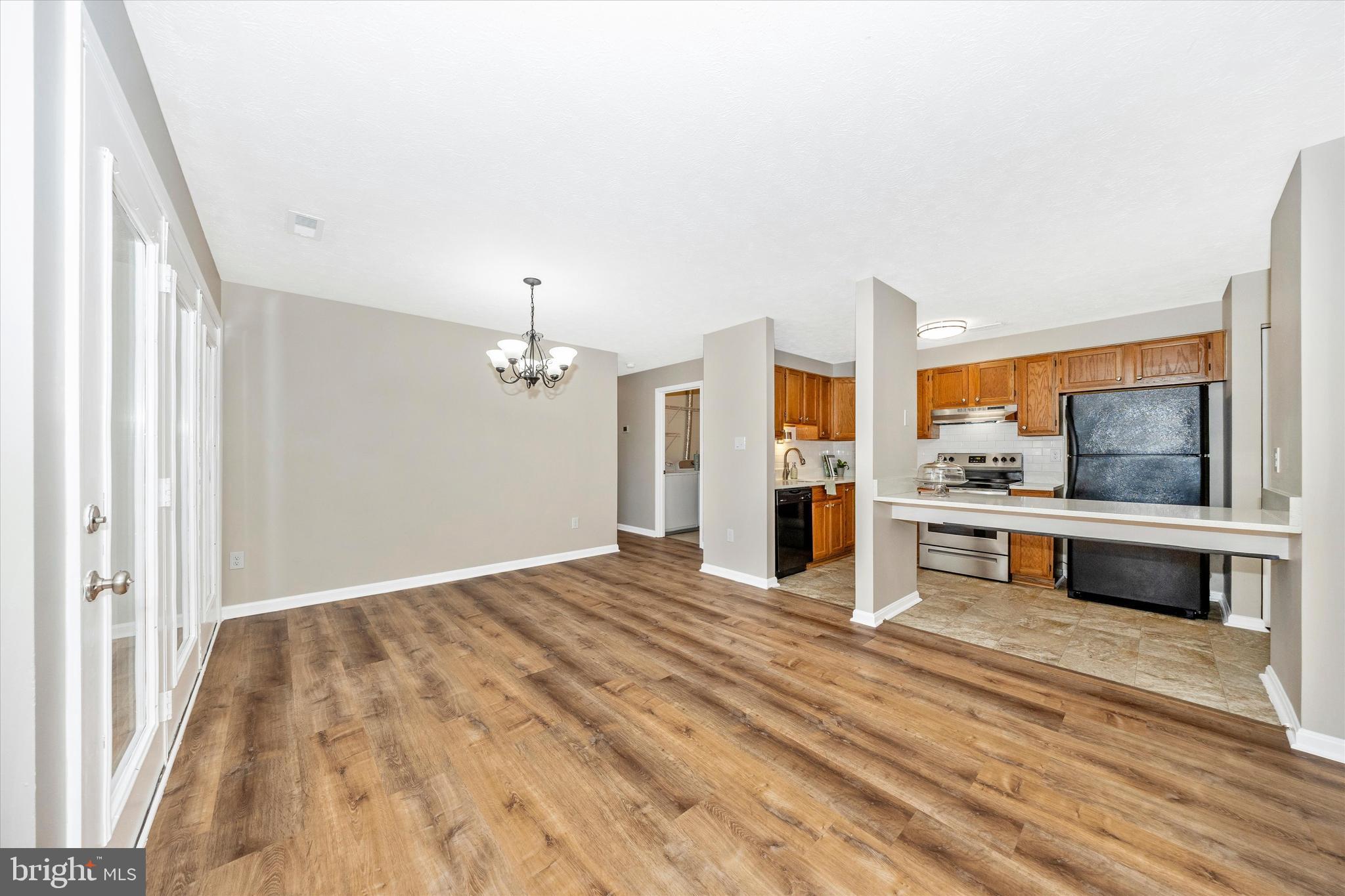 2112 Whitehall Road, Unit 1C Frederick, MD 21702 - Photo 9 of 33 a view of a kitchen with granite countertop cabinets stainless steel appliances and a window