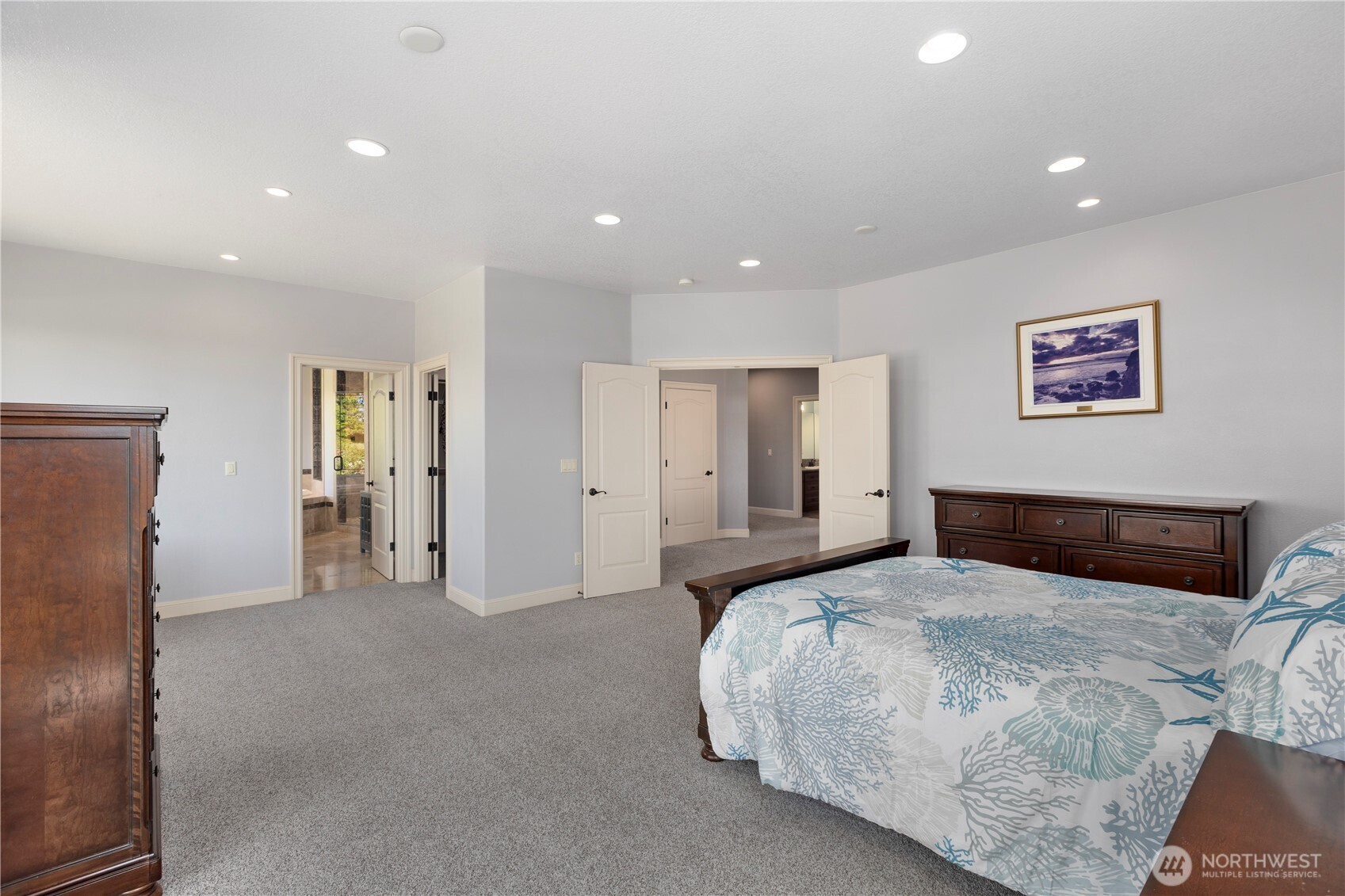 3015 Lighthouse Keepers Road Ilwaco, WA 98624 - Photo 18 of 40 a bedroom with a bed and a refrigerator