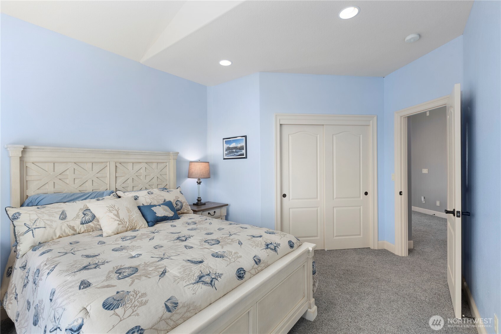 3015 Lighthouse Keepers Road Ilwaco, WA 98624 - Photo 26 of 40 a bedroom with a bed and a night stand