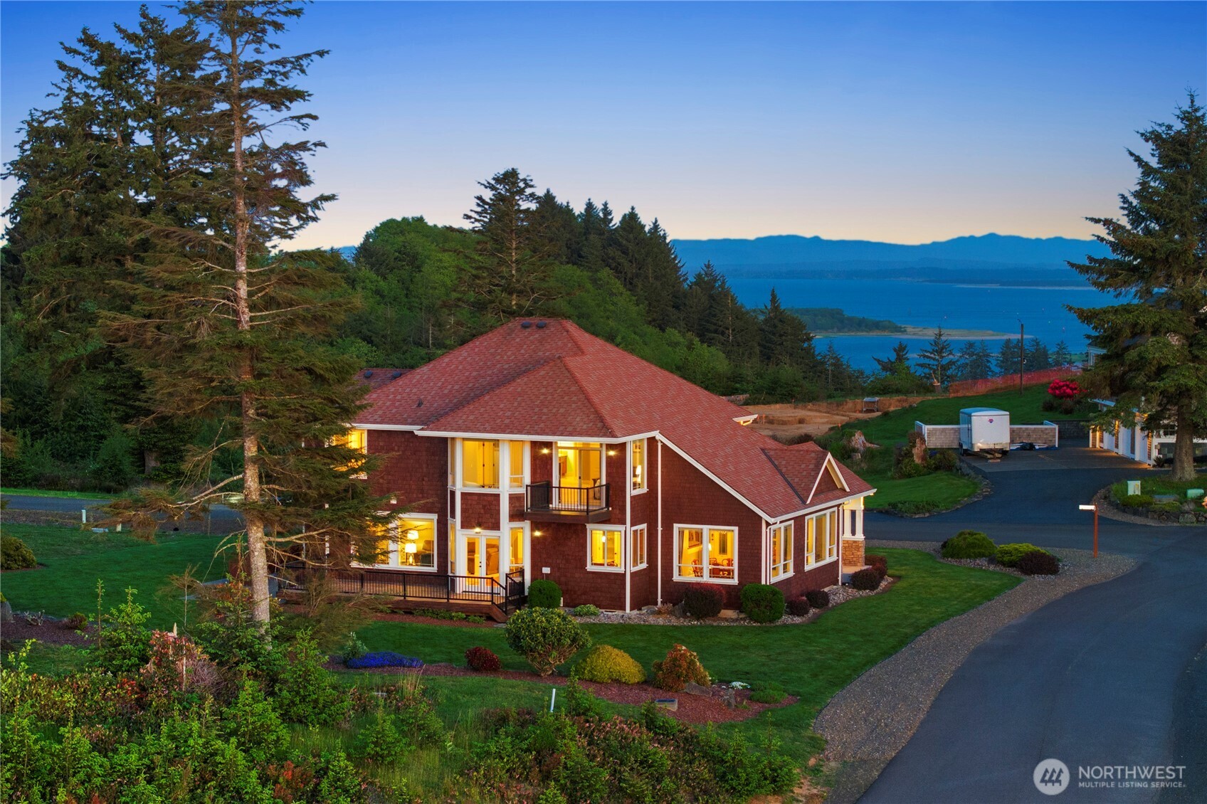3015 Lighthouse Keepers Road Ilwaco, WA 98624 - Photo 3 of 40 a front view of a house with garden