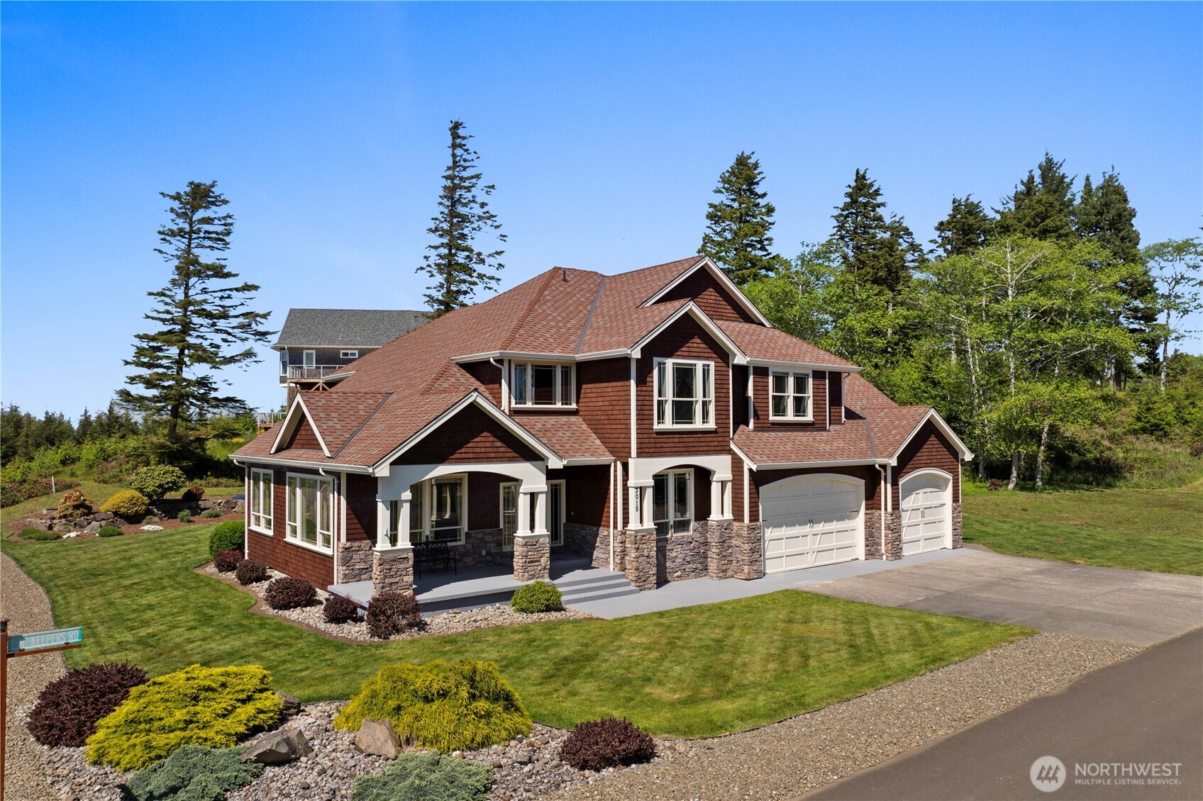 3015 Lighthouse Keepers Road Ilwaco, WA 98624 - Photo 40 of 40 a front view of a house with garden