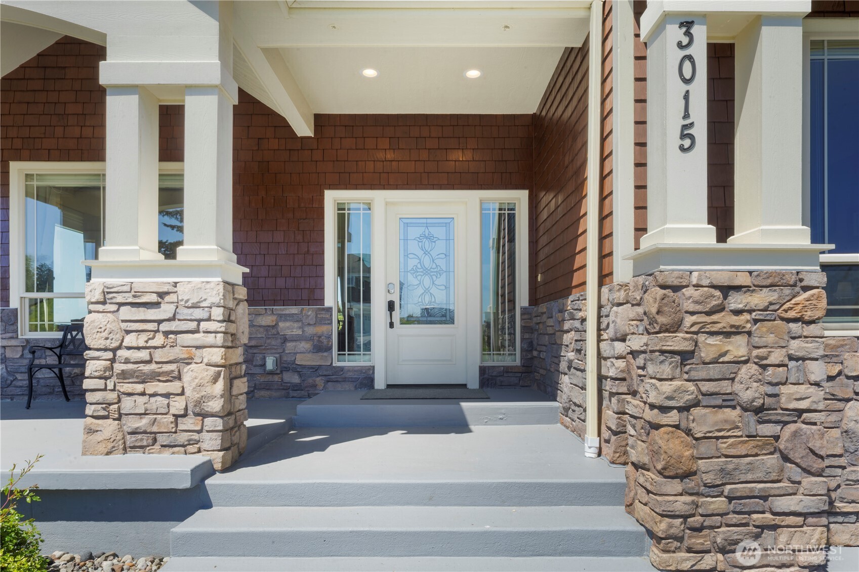 3015 Lighthouse Keepers Road Ilwaco, WA 98624 - Photo 6 of 40 a view of front door of house with stairs