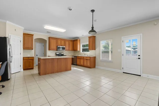 a kitchen with stainless steel appliances a sink counter top space cabinets and a kitchen view