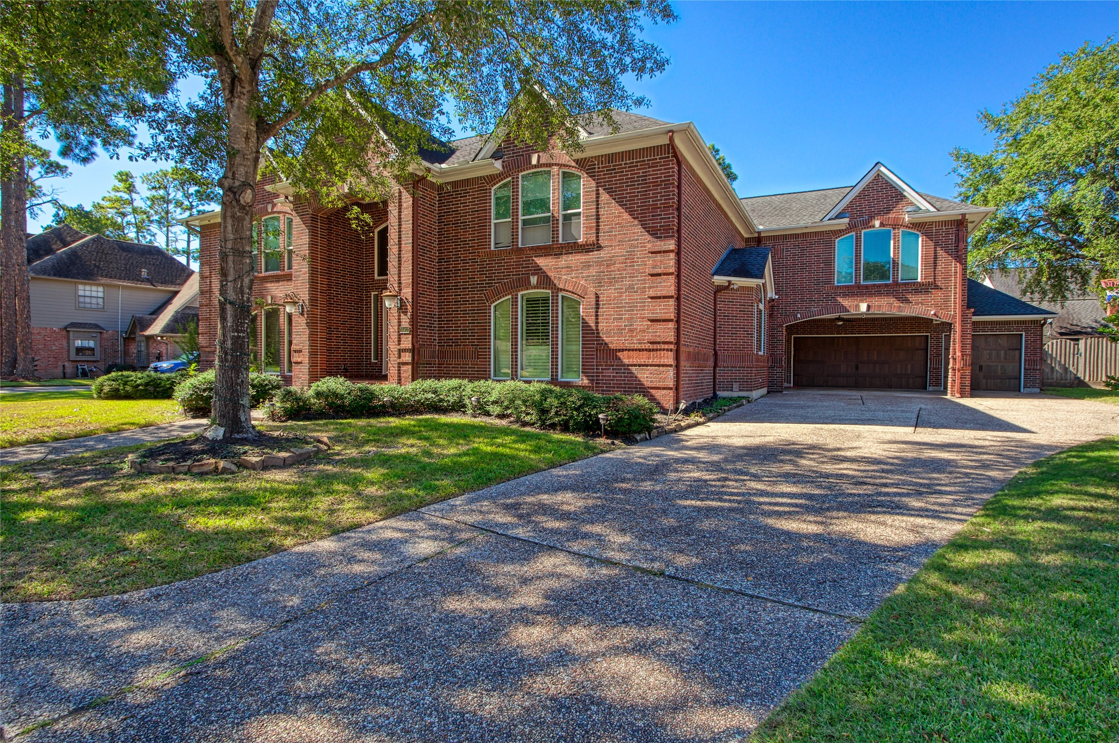 14907 Pine Point Court Houston, TX 77070 - Photo 1 of 33 a front view of a house with yard and trees