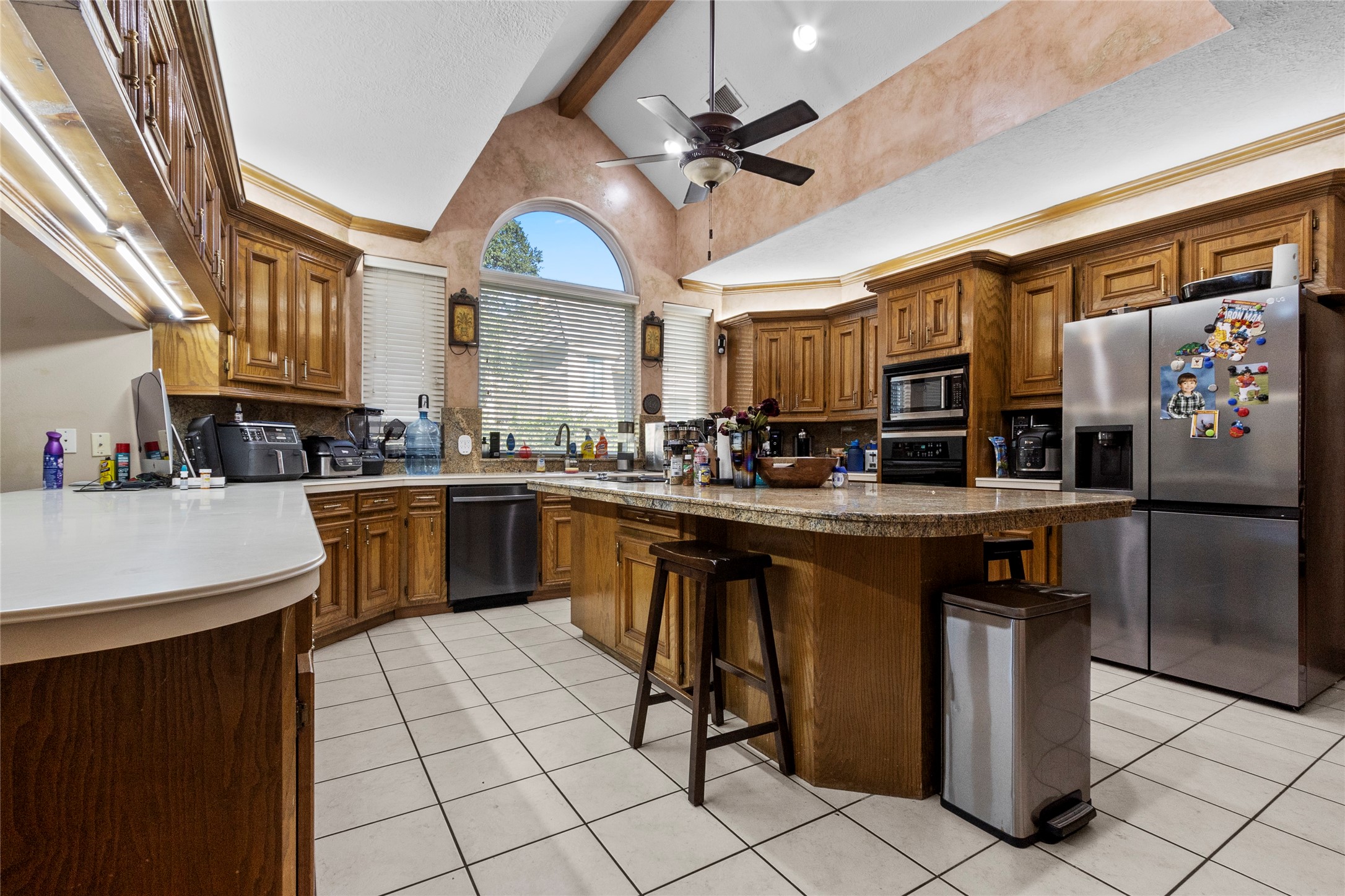 14907 Pine Point Court Houston, TX 77070 - Photo 11 of 33 a kitchen with stainless steel appliances granite countertop a sink a counter top space cabinets and stainless steel appliances