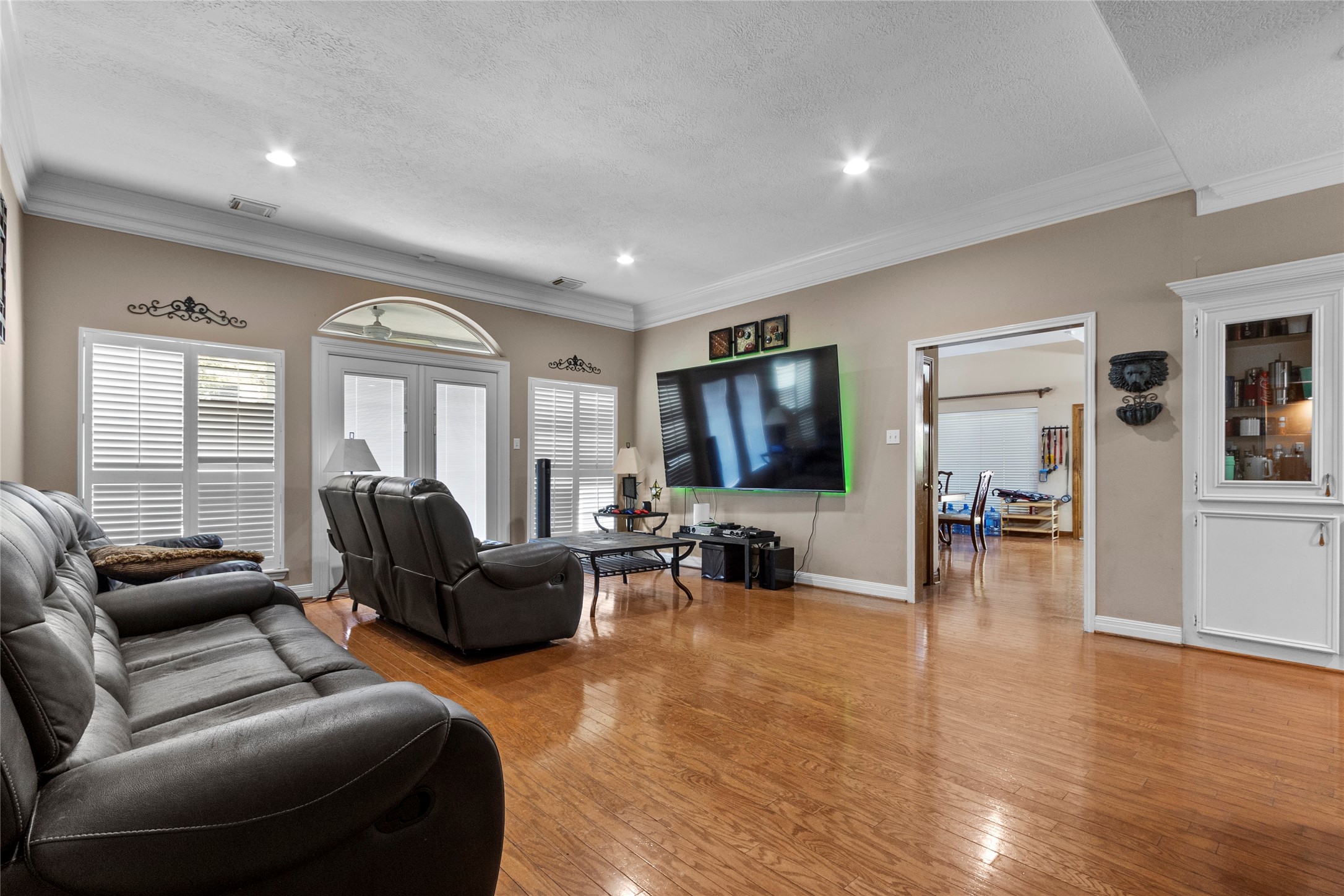 14907 Pine Point Court Houston, TX 77070 - Photo 17 of 33 a living room with furniture and a flat screen tv