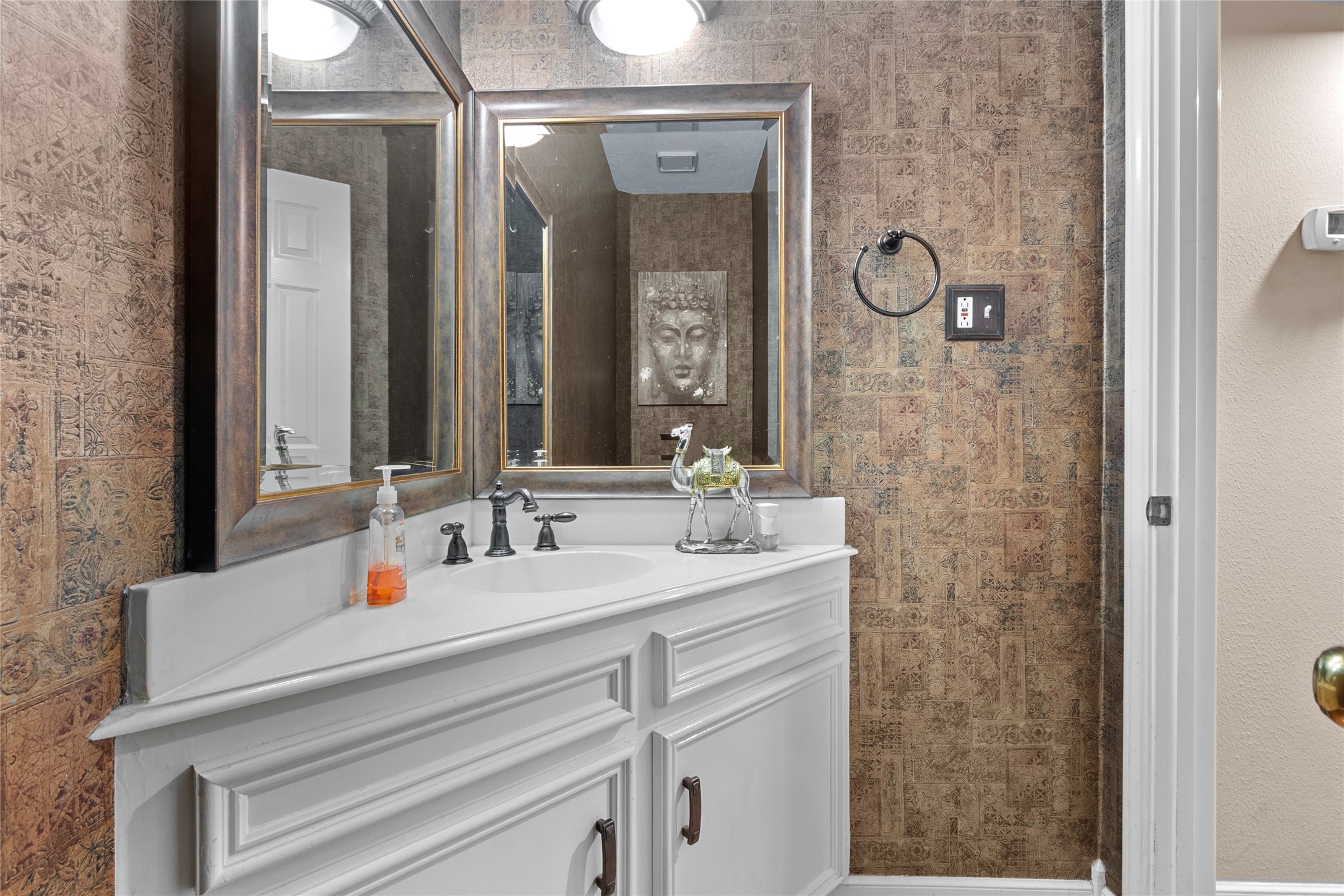 14907 Pine Point Court Houston, TX 77070 - Photo 19 of 33 a bathroom with a sink and a mirror