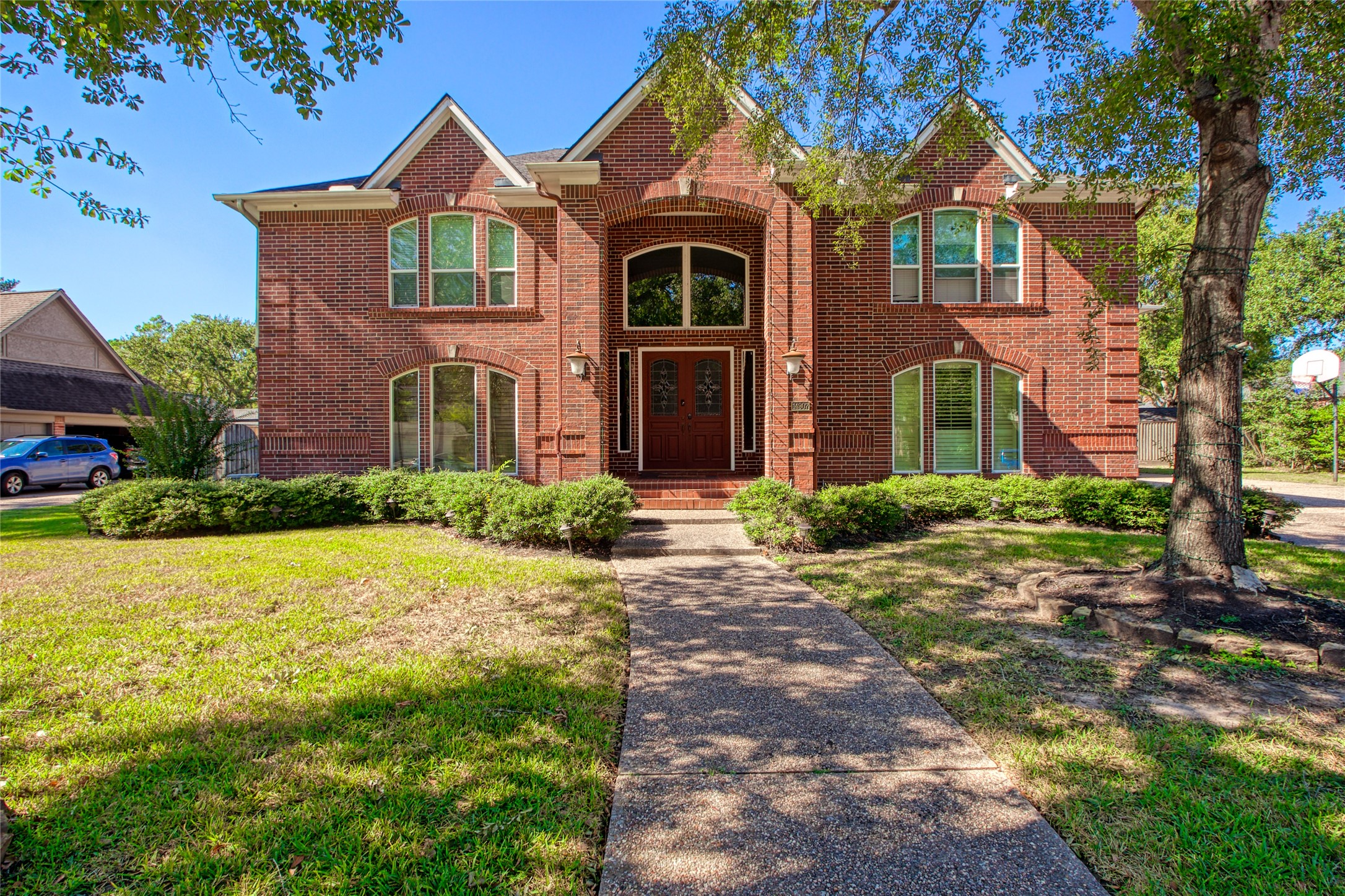 14907 Pine Point Court Houston, TX 77070 - Photo 2 of 33 a front view of a house with yard and green space