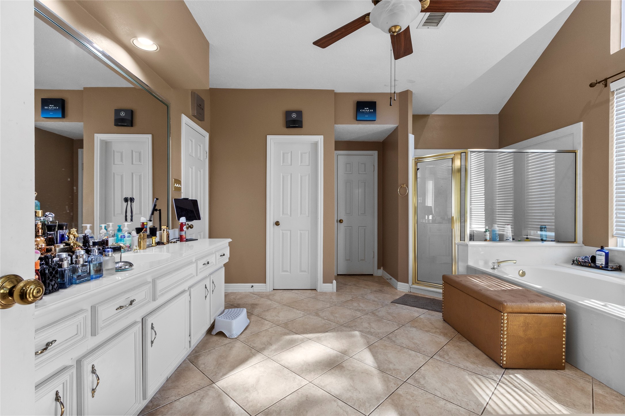 14907 Pine Point Court Houston, TX 77070 - Photo 22 of 33 a large spacious bathroom with a double vanity sink a mirror and a bathtub