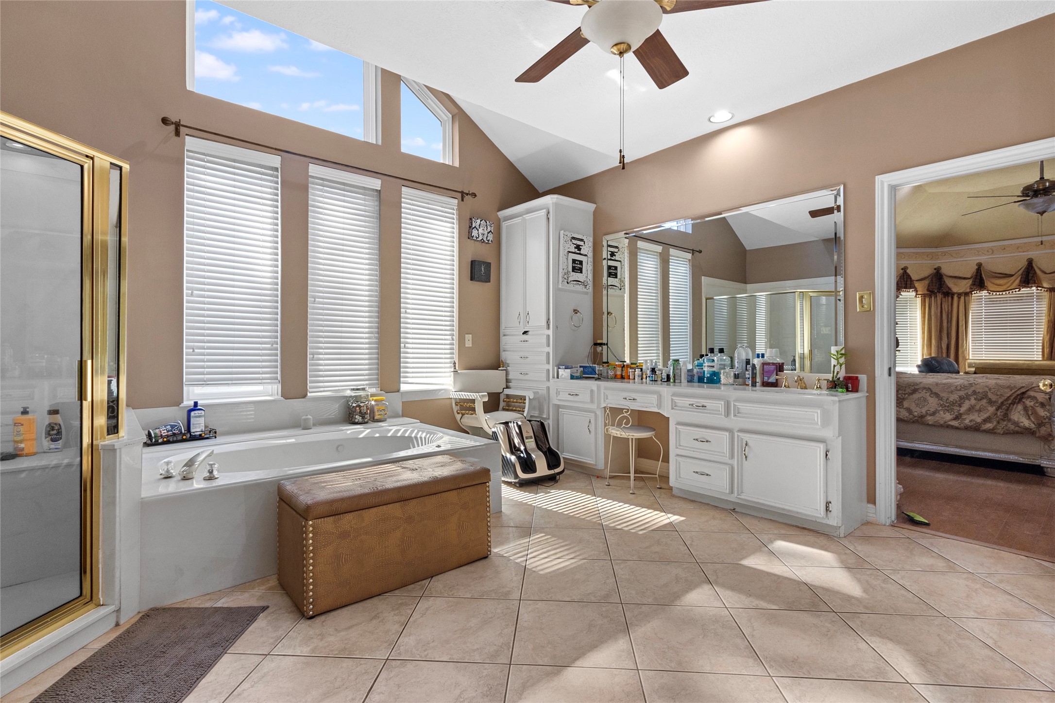 14907 Pine Point Court Houston, TX 77070 - Photo 25 of 33 a large spacious bathroom with a granite countertop tub sink shower and mirror