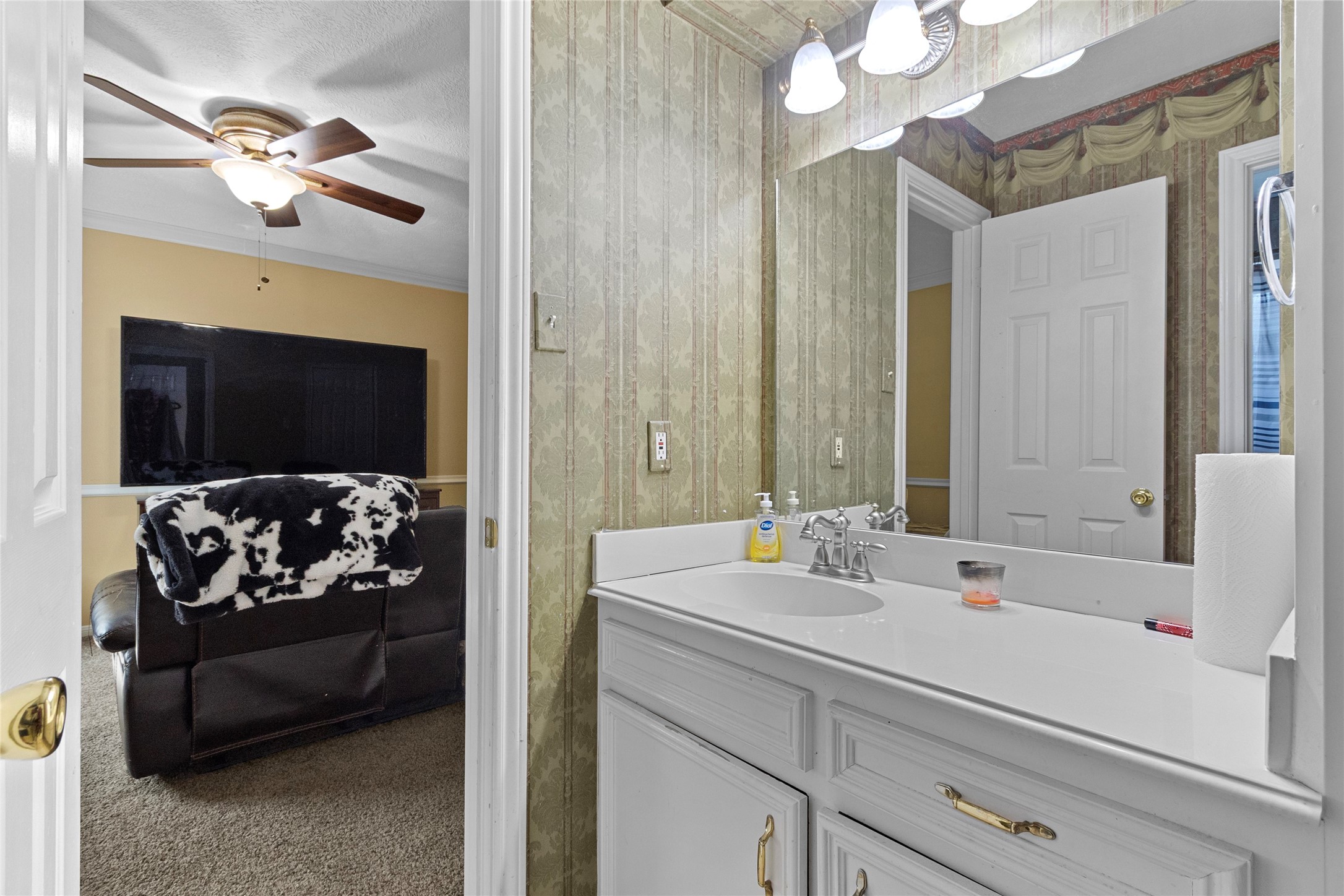 14907 Pine Point Court Houston, TX 77070 - Photo 27 of 33 a bathroom with a sink a large mirror and a shower
