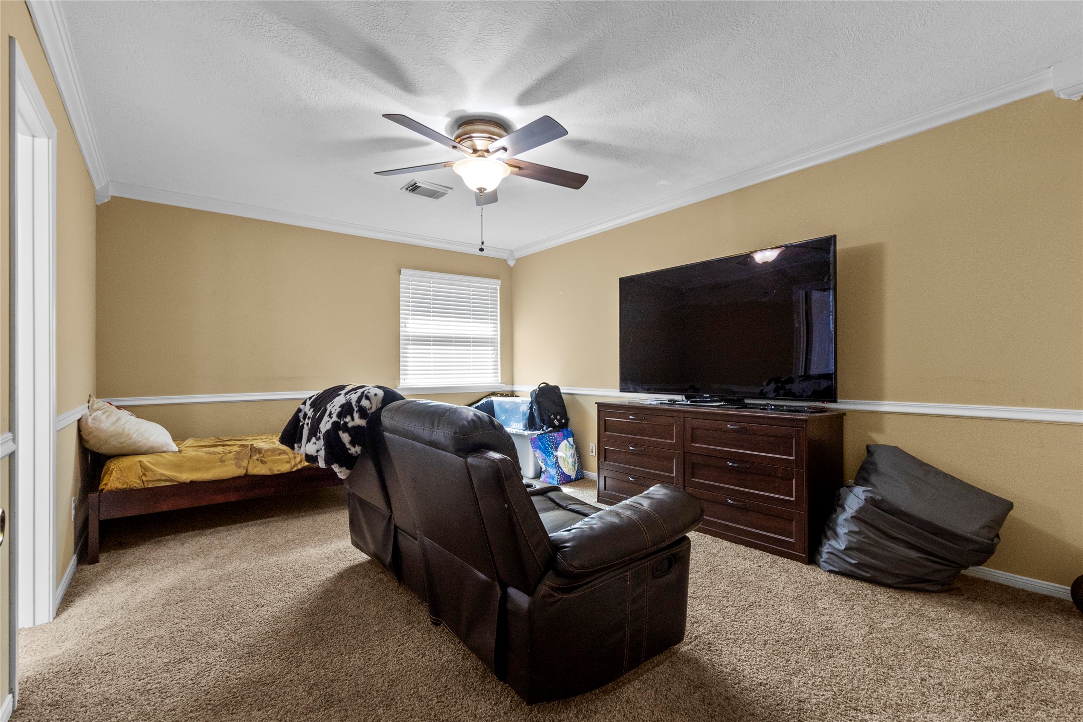 14907 Pine Point Court Houston, TX 77070 - Photo 28 of 33 a living room with furniture and a flat screen tv