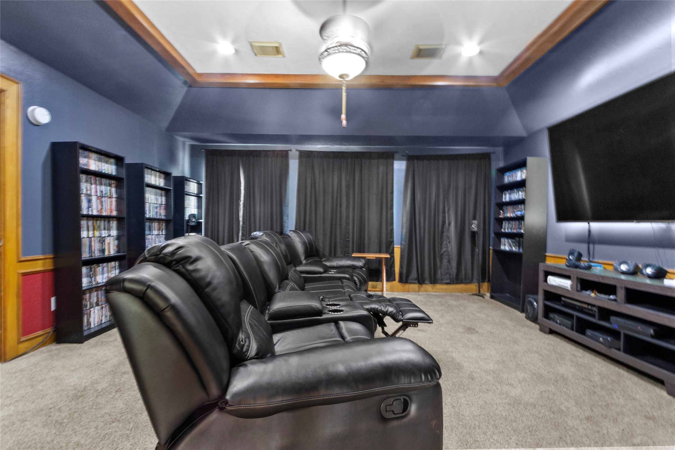 14907 Pine Point Court Houston, TX 77070 - Photo 29 of 33 a projector room with furniture and a flat screen tv