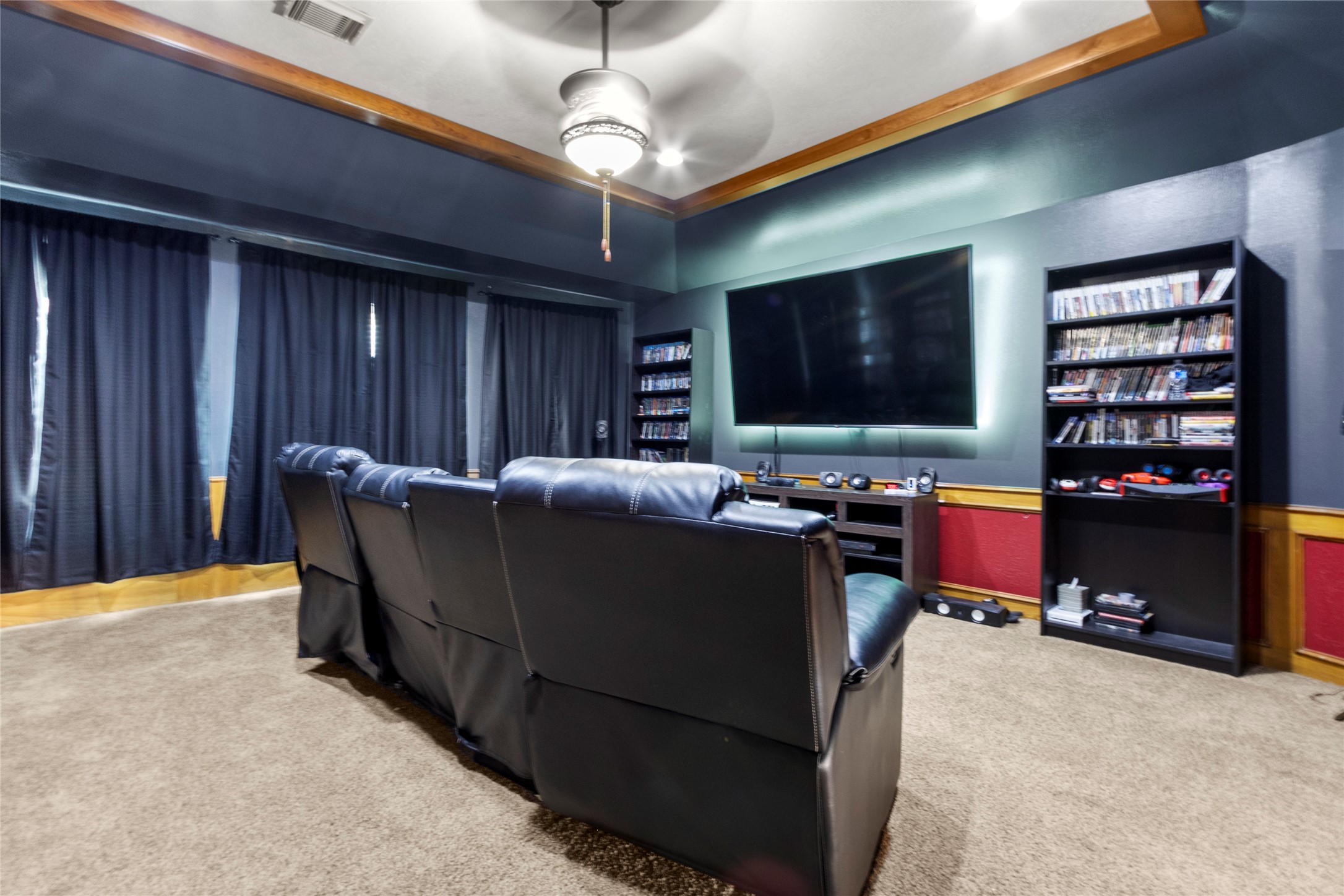 14907 Pine Point Court Houston, TX 77070 - Photo 30 of 33 a living room with furniture and a flat screen tv