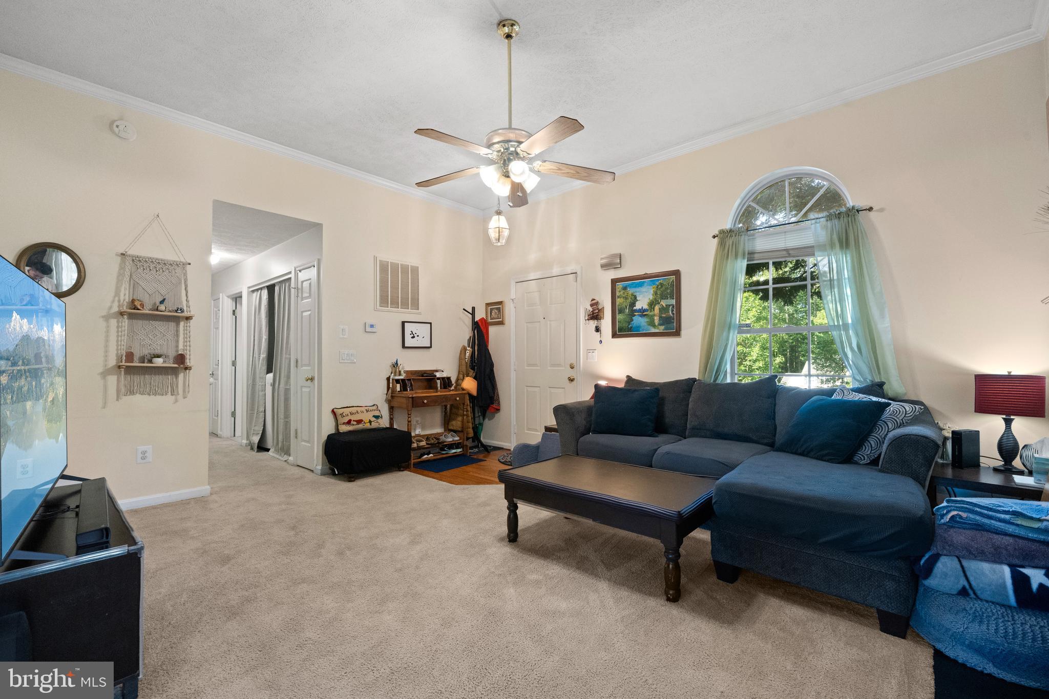 1127 Garner Drive King George, VA 22485 - Photo 2 of 39 a living room with furniture and a chandelier