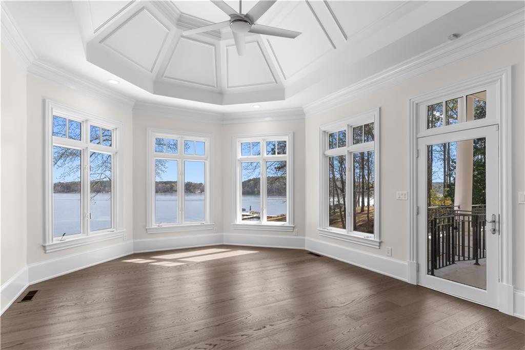1070 Prosperity Point Greensboro, GA 30642 - Photo 13 of 38 a view of an empty room with wooden floor and a window