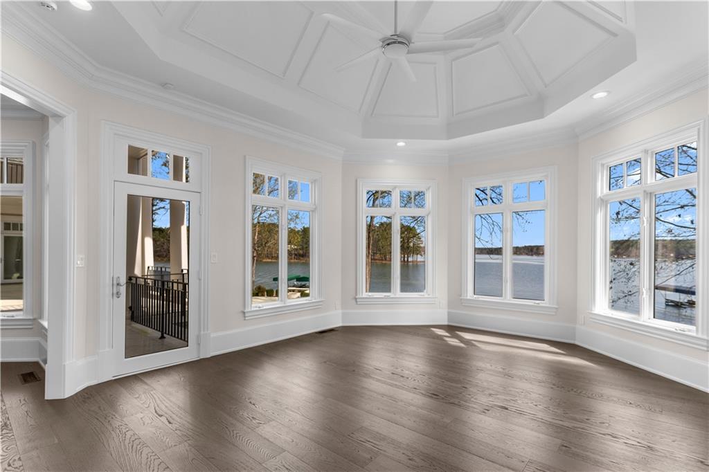 1070 Prosperity Point Greensboro, GA 30642 - Photo 16 of 38 a view of an empty room with wooden floor and a window