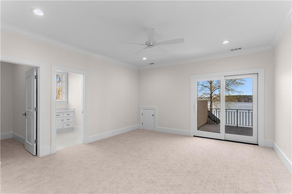 1070 Prosperity Point Greensboro, GA 30642 - Photo 23 of 38 an empty room with sliding door and windows