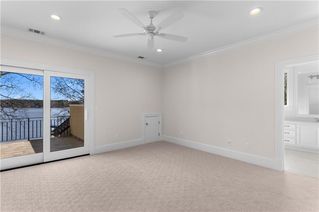 1070 Prosperity Point Greensboro, GA 30642 - Photo 25 of 38 wooden floor in an empty room with a ceiling fan