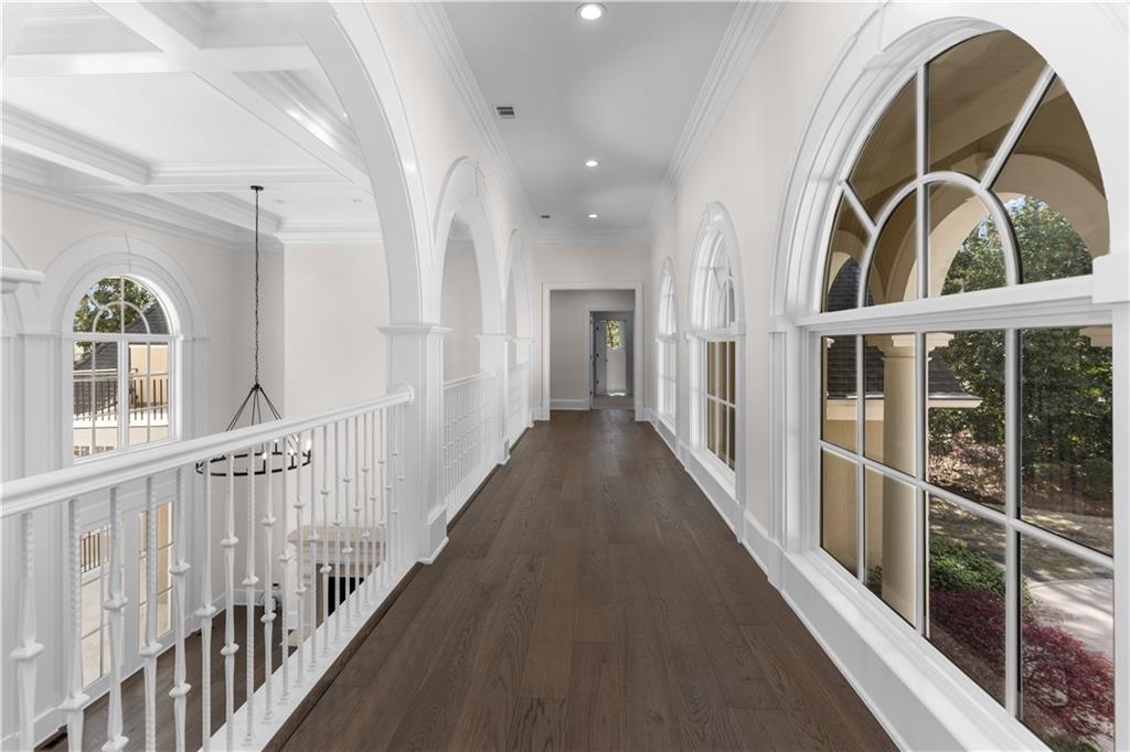 1070 Prosperity Point Greensboro, GA 30642 - Photo 26 of 38 wooden floor with a staircase