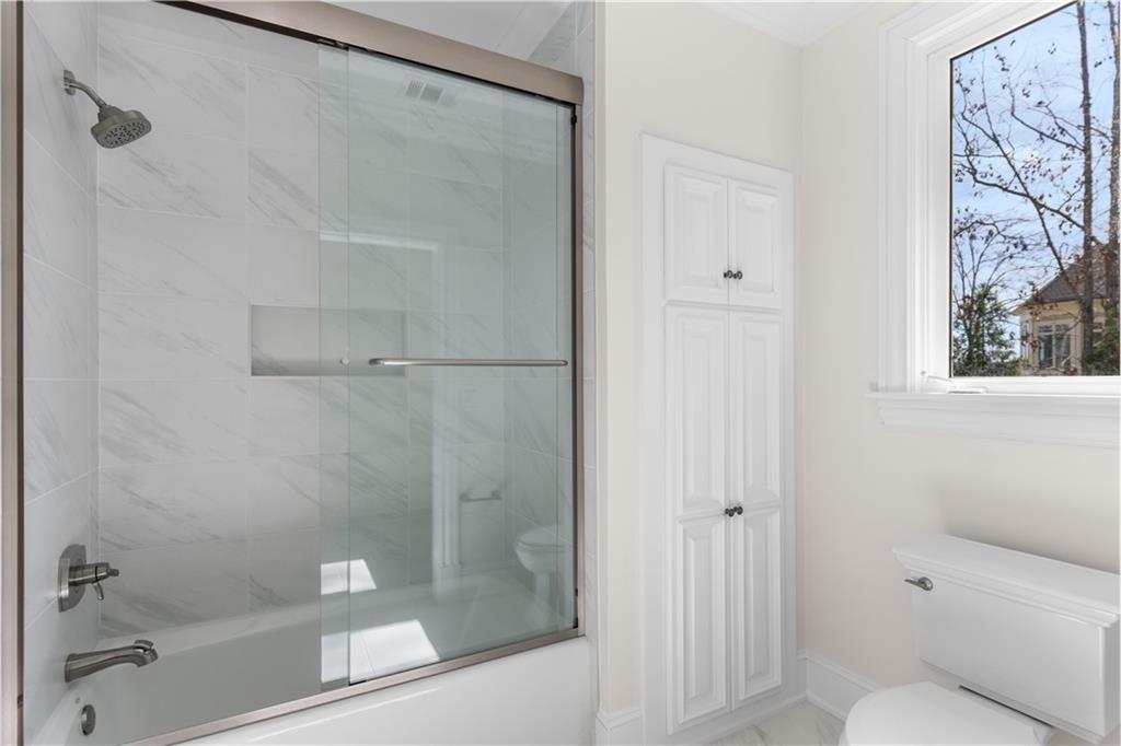 1070 Prosperity Point Greensboro, GA 30642 - Photo 27 of 38 a bathroom with a shower and a toilet