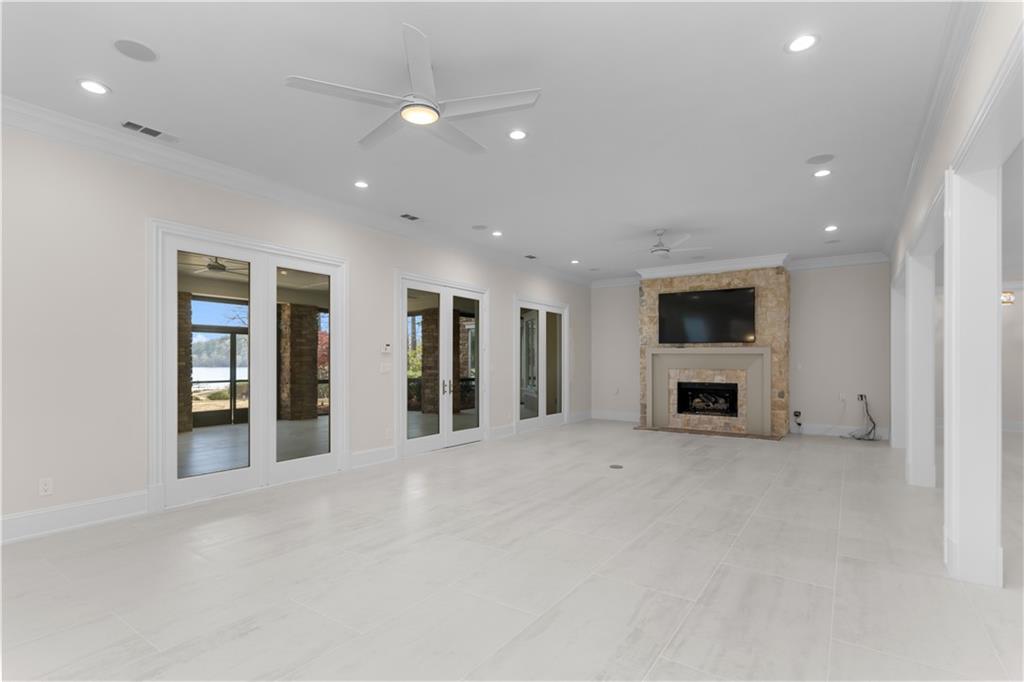 1070 Prosperity Point Greensboro, GA 30642 - Photo 28 of 38 a view of an empty room with a fireplace and a window