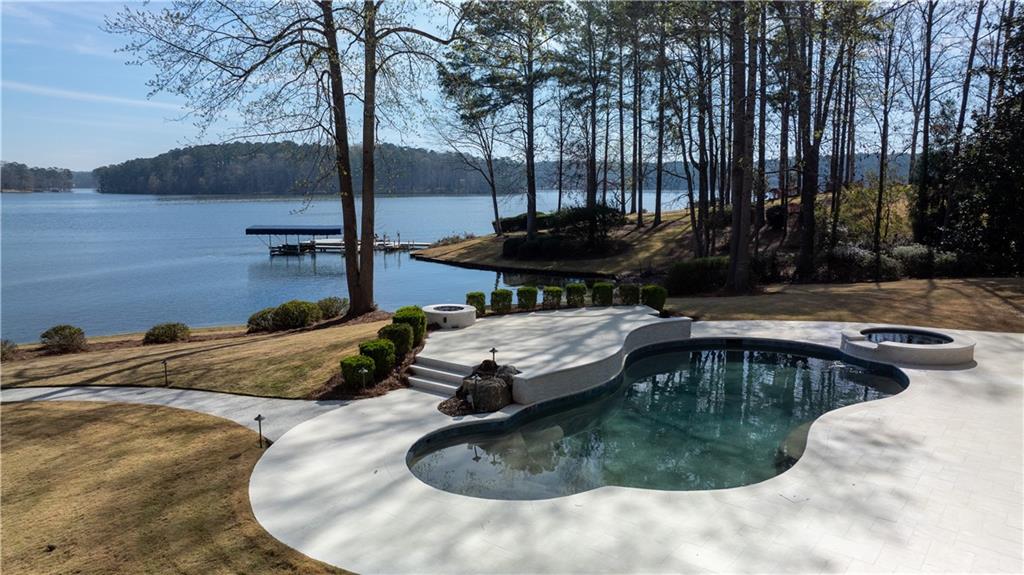 1070 Prosperity Point Greensboro, GA 30642 - Photo 6 of 38 a view of a swimming pool with a yard