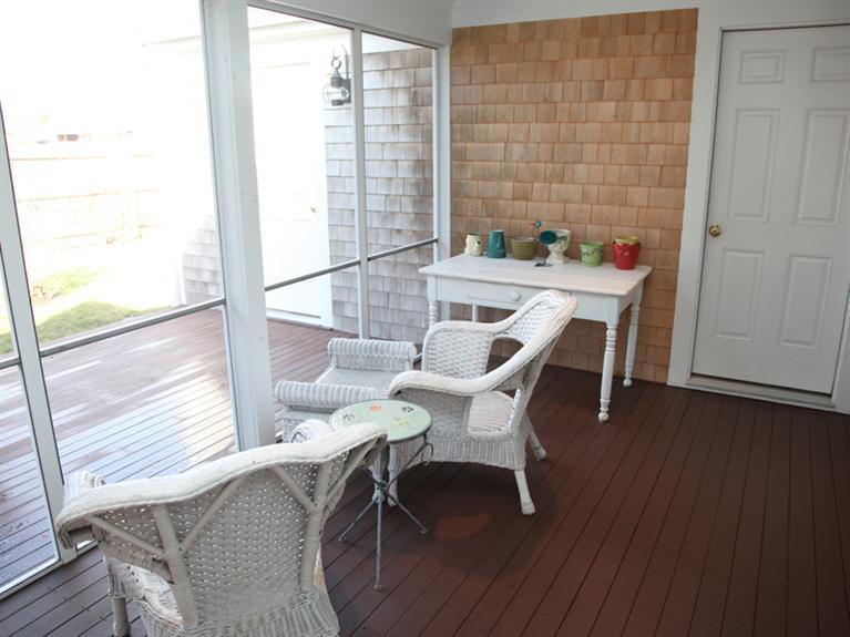 69 Goodview Way Barnstable, MA 02630 - Photo 12 of 17 a view of a dining room with furniture and wooden floor