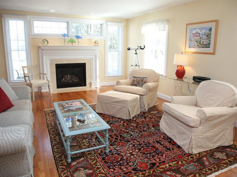 69 Goodview Way Barnstable, MA 02630 - Photo 3 of 17 a living room with furniture and a fireplace