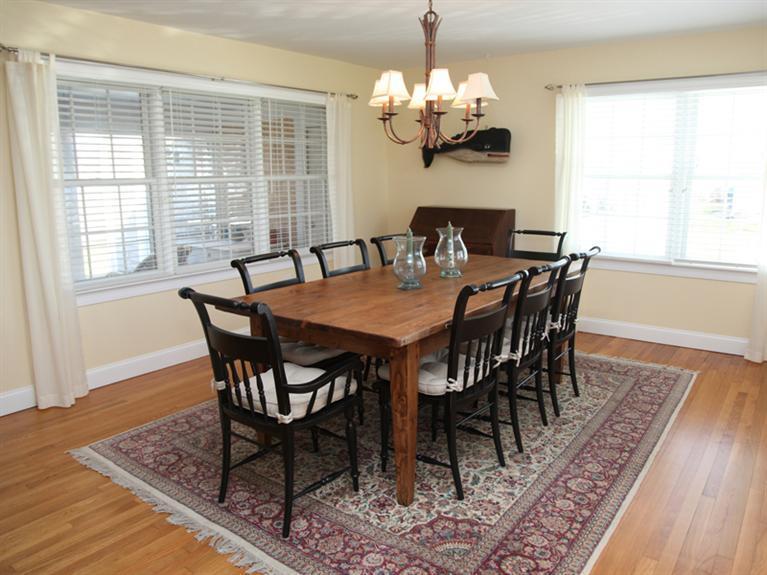 69 Goodview Way Barnstable, MA 02630 - Photo 6 of 17 a view of a dining room with furniture wooden floor and a chandelier