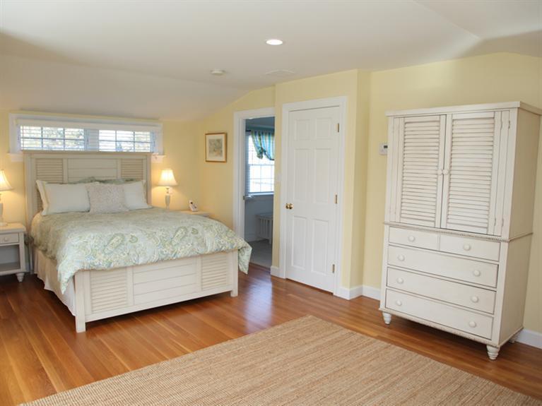 69 Goodview Way Barnstable, MA 02630 - Photo 7 of 17 a bedroom with a large bed and wooden floor
