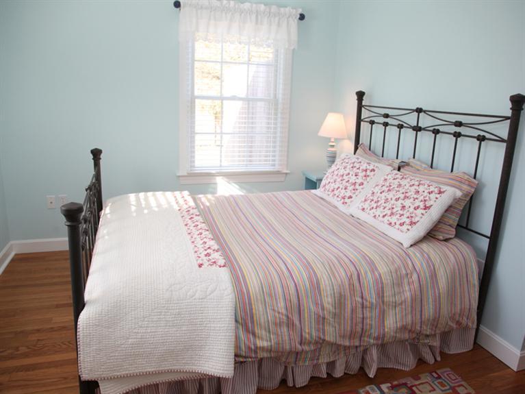 69 Goodview Way Barnstable, MA 02630 - Photo 10 of 17 a bed sitting in a bedroom next to a window