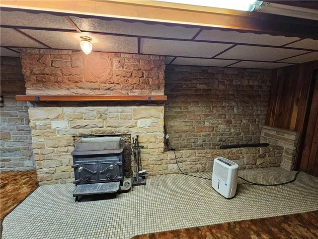 a view of a back yard with wooden walls