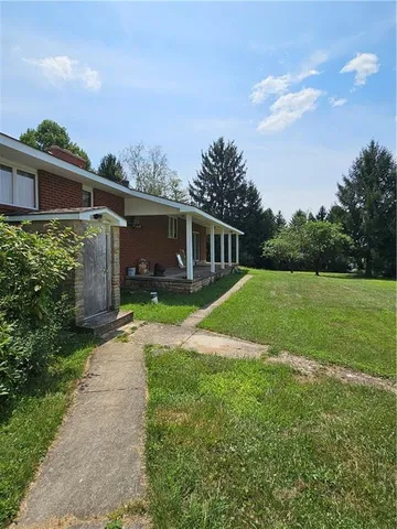 a backyard of a house with lots of green space
