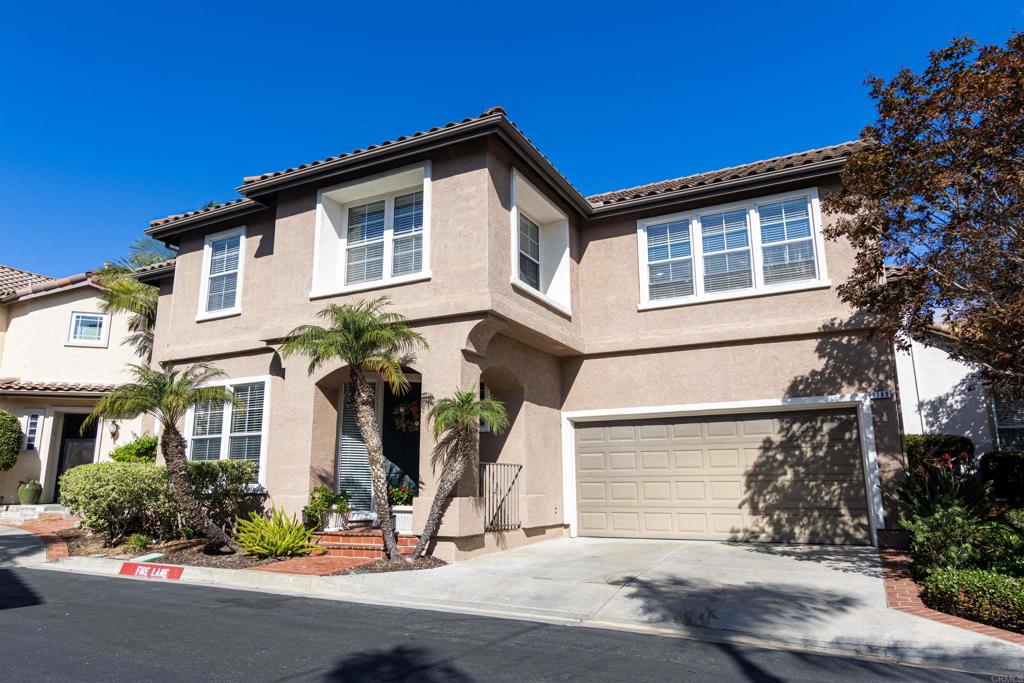 7189 Tanager Drive Carlsbad, CA 92011 - Photo 1 of 31 a front view of a house with a yard
