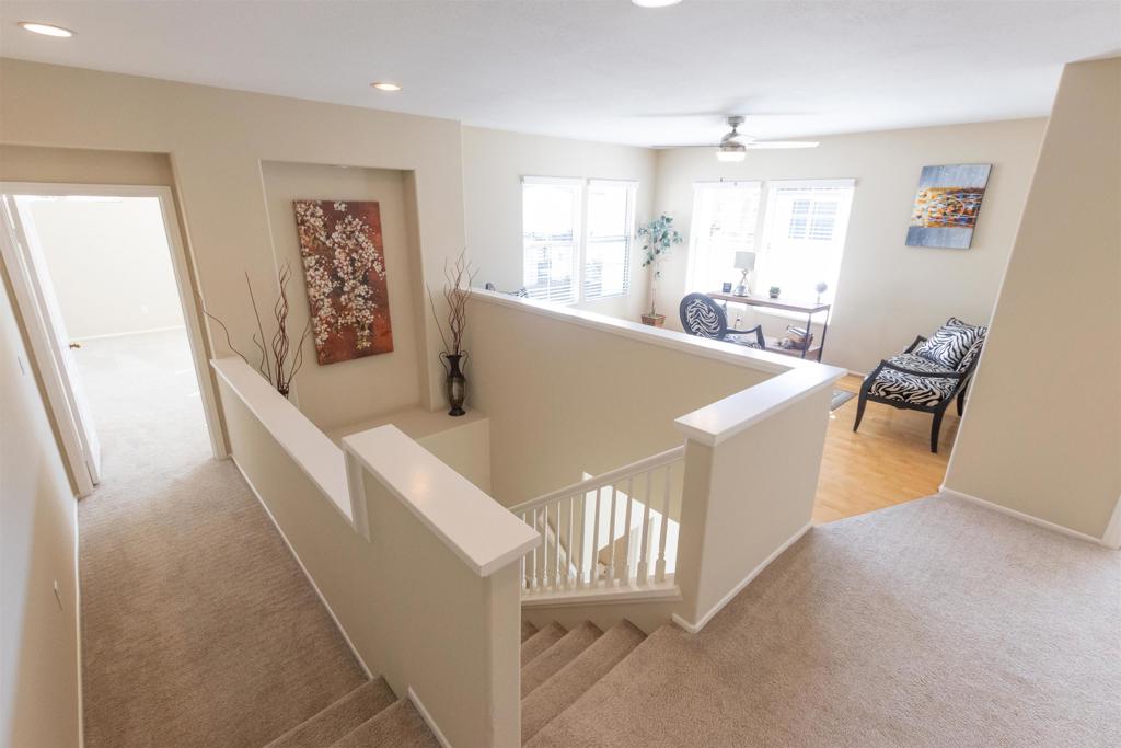 7189 Tanager Drive Carlsbad, CA 92011 - Photo 14 of 31 a living room with furniture and a large window