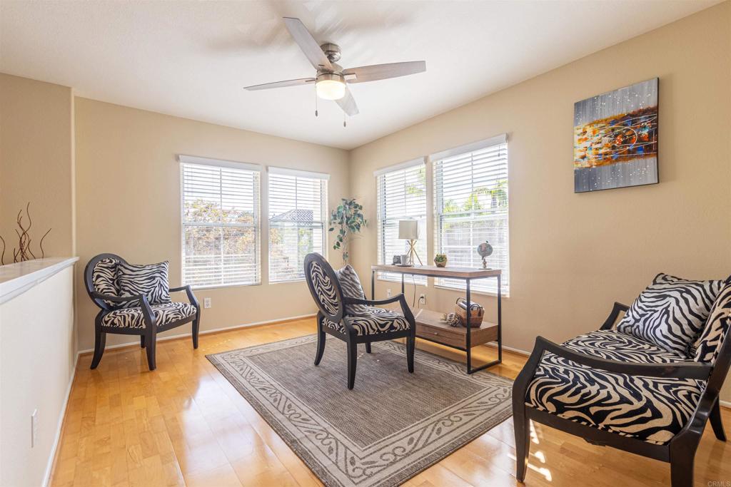 7189 Tanager Drive Carlsbad, CA 92011 - Photo 16 of 31 a living room with furniture and a large window
