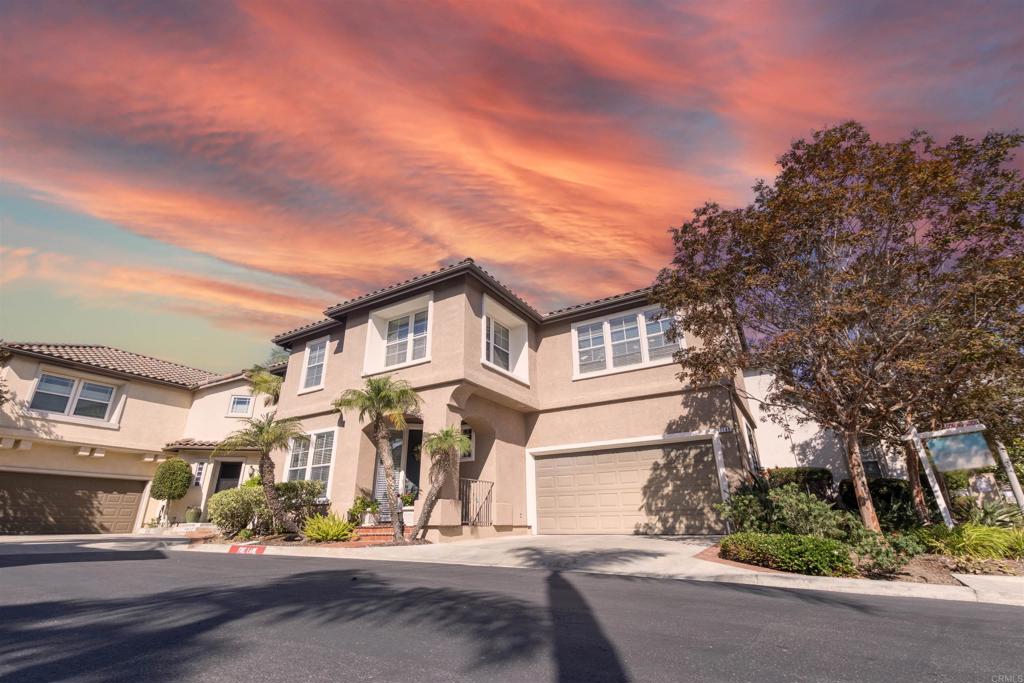 7189 Tanager Drive Carlsbad, CA 92011 - Photo 2 of 31 a front view of a house with a yard