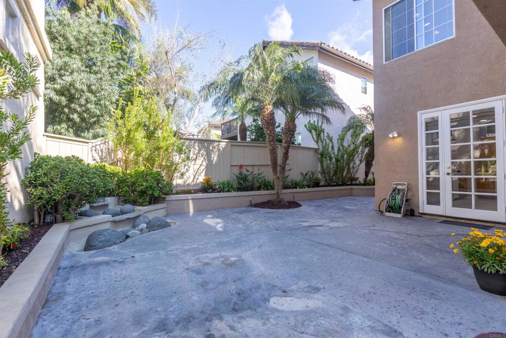 7189 Tanager Drive Carlsbad, CA 92011 - Photo 21 of 31 a view of a house with backyard and plants