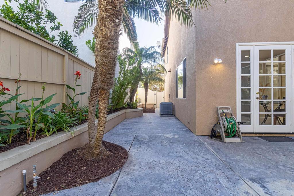 7189 Tanager Drive Carlsbad, CA 92011 - Photo 22 of 31 a view of a house with a yard and potted plants
