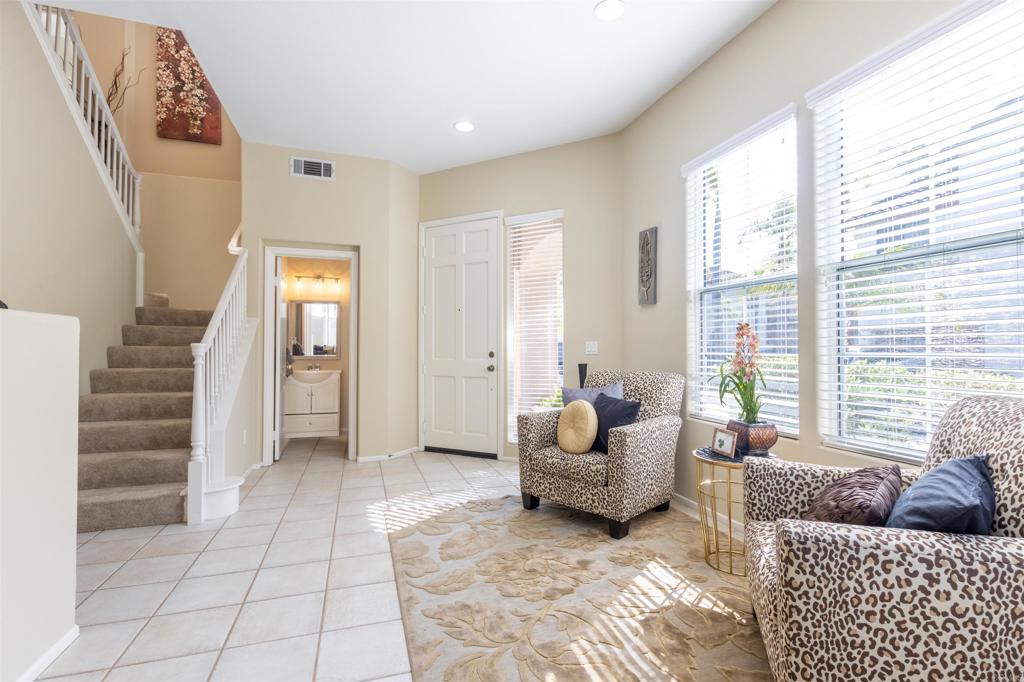 7189 Tanager Drive Carlsbad, CA 92011 - Photo 3 of 31 a living room with furniture and a window