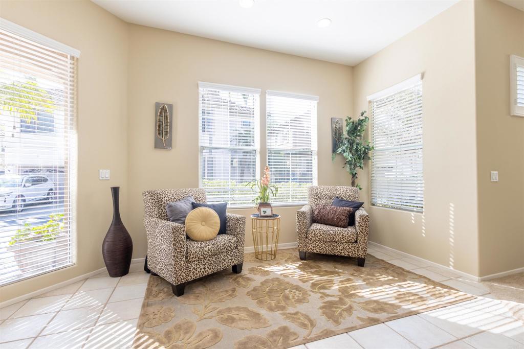 7189 Tanager Drive Carlsbad, CA 92011 - Photo 4 of 31 a living room with furniture and a large window