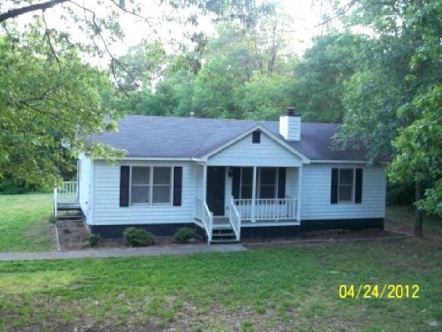 1196 Stringer Road Rockmart, GA 30153 - Photo 1 of 1 front view of a house with a yard