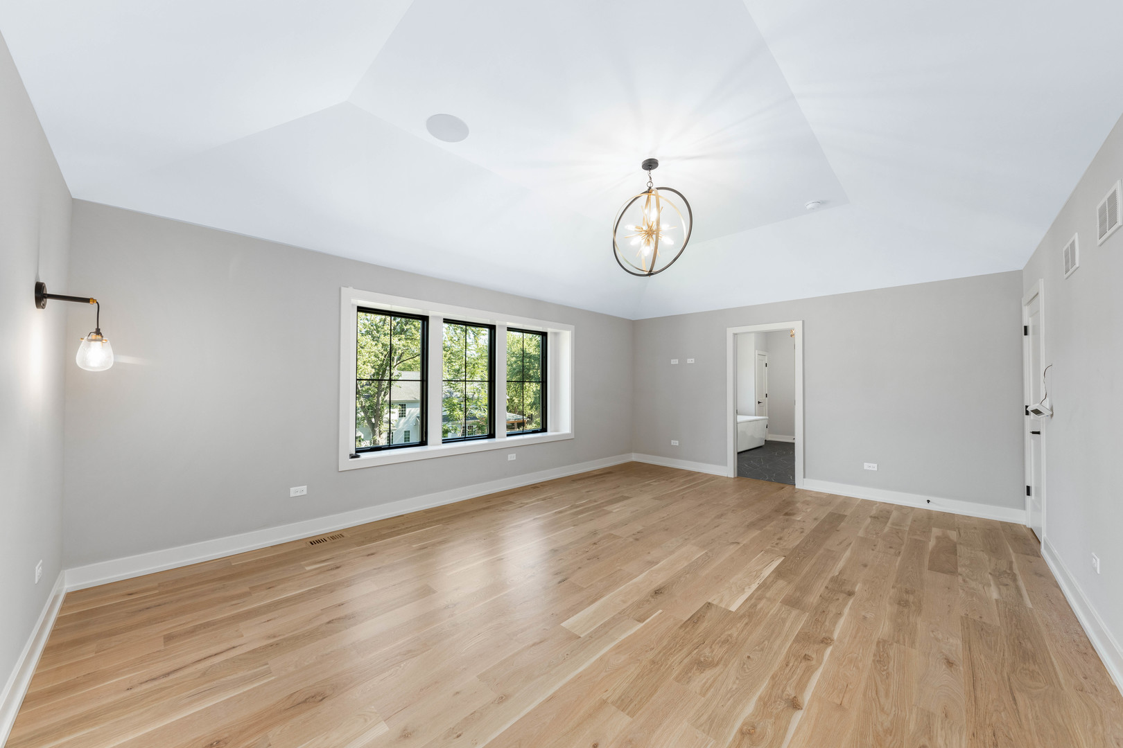 1314 Eagle Street Naperville, IL 60563 - Photo 12 of 26 a view of an empty room with wooden floor and a window